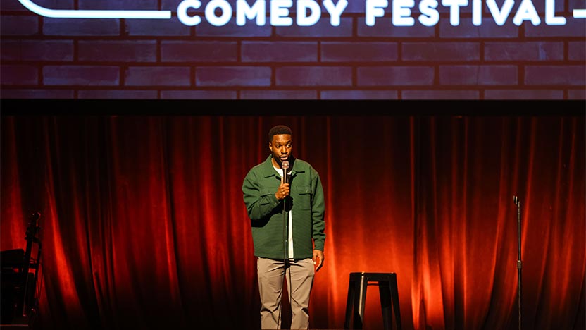 comedian on stage preforming stand-up act at BTF 2023