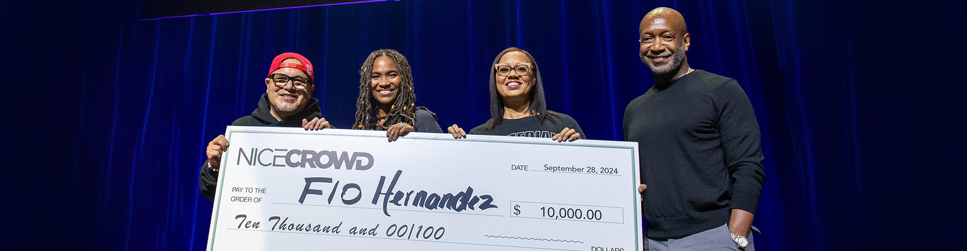 2024 winner Flo Hernandez receiving check